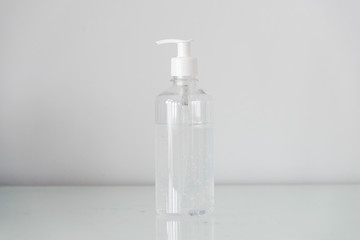 Plastic bottle pump with alcohol gel on the table with copy space. For cleaning hand and clear bacteria for stop corona virus outbreak. Protection against the virus, Covid 19, coronavirus 2019.