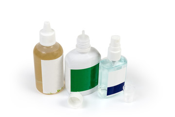 Various plastic bottles of antiseptic on a white background