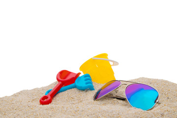 Fototapeta na wymiar beach toys with sunglasses on sand isolated