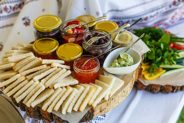 Beautifully decorated catering banquet table with different food snacks and appetizers with sandwich