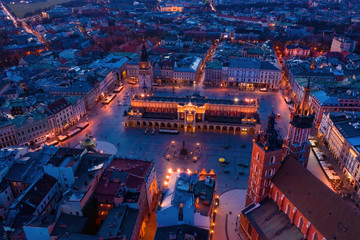 Basilica at Krakow old town city square at twilight drone aerial view
