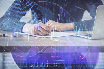 Double exposure hands with stock market chart.
