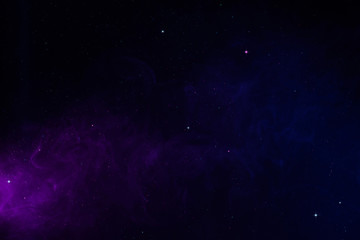 Space background with realistic spacedust and shining stars. Magical colorful universe abstract...