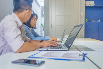 The man and woman working on laptop at business office