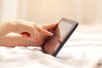 Closeup of kid's hands holding digital tablet for playing and education. Education knowlege, technology internet, distance learning