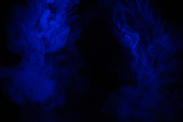 Blue smoke clouds on black, abstract background