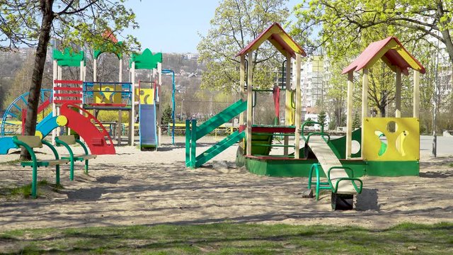Empty children playground during quarantine by reason of coronavirus covid-19 virus threat. State of emergency. 4K