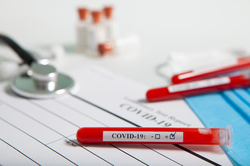 World coronavirus epidemic concept. Pandemic COVID-19, 2019-nKoV. Coronavirus vaccine testing. Positive analysis and laboratory blood sample. Test tube, vaccine, mask.