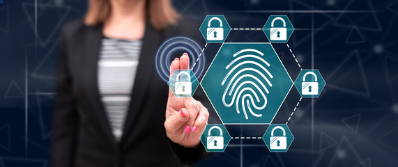 Woman touching a fingerprint security system concept