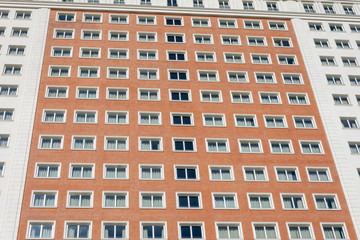 Building facade view with windows, in red and white, horizontal