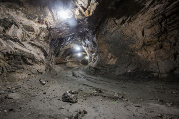 Underground gold quartz mine shaft tunnel drift with light