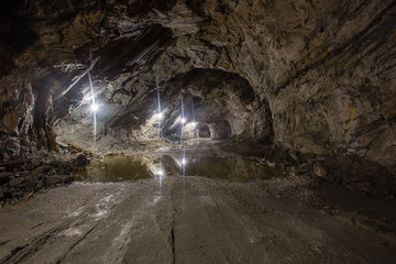 Underground gold quartz mine shaft tunnel drift with light