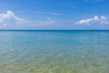 Fototapeta na wymiar Clear water sand beach and blue sky