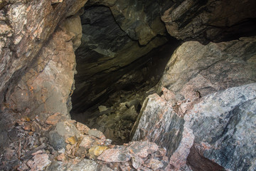 Fototapeta na wymiar Underground quartz ore mine tunnel collapsed cavity 