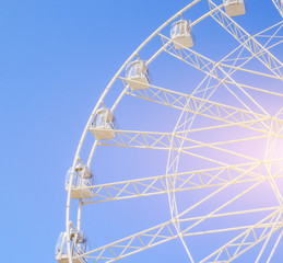 Ferris wheel in the blue sky . view the city from a height. entertainment on vacation .