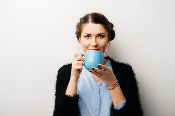 Woman with big blue cup, drink tea or coffee. Isolated on a white background