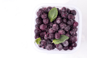 frozen currant berries close-up top view on a white background