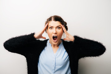 Woman thinks dissatisfied, angry, resentful. Isolated on a white background