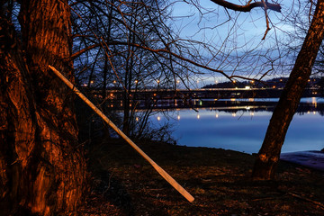 Stockholm, Sweden  Night landscape over Lake Mälaren looking towards Varby and the E4 highway, and oars for a rowing boat.