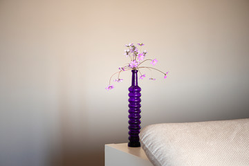 Home decor purple vase with Hepatica purple flowers