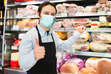 Shopkeeper wearing a mask