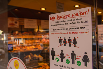 German Sign in front of a store in Frankfurt am Main about the Corona virus pandemic situation