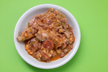 typical portuguese dish beans with cabbafe and smoked meat in dish