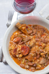 typical portuguese dish beans with cabbafe and smoked meat in dish