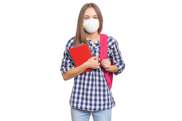 Concept of coronavirus quarantine. Child wearing medical protective face mask to health protection from influenza virus. COVID-19. Student teen Girl with bag and books, isolated on white background.