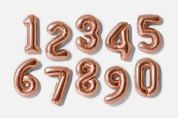 Set of numbers 0-9, Rose gold foil balloon number isolated on a white background