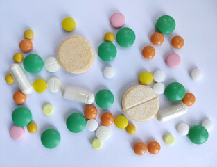 Stack of colourful pills, medicine background
