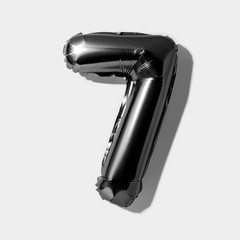 Number 7, Black foil balloon number seven isolated on a white background with Clipping Path