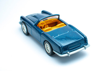 Blue toy car on white background