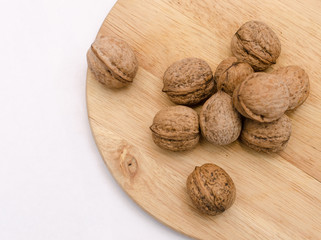 fresh walnuts, superfood, healthy foods, nuts on a wooden surface, close-up