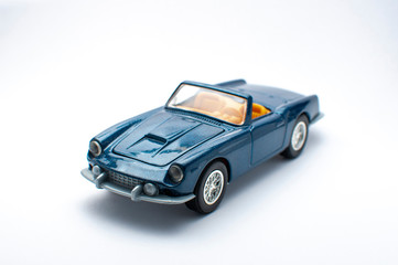 Blue toy car on white background