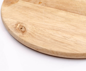 part of a light wooden serving board, on a white background, close-up wooden texture