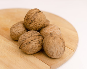 fresh walnuts, superfood, healthy foods, nuts on a wooden surface, close-up