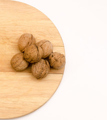 fresh walnuts, superfood, healthy foods, nuts on a wooden surface, close-up