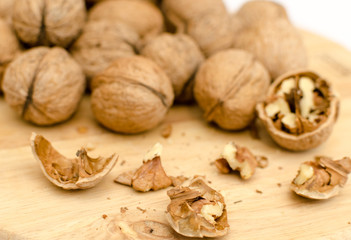 fresh walnuts, superfood, healthy foods, nuts on a wooden surface, close-up