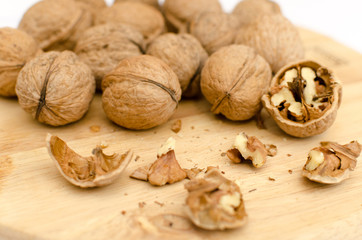 fresh walnuts, superfood, healthy foods, nuts on a wooden surface, close-up