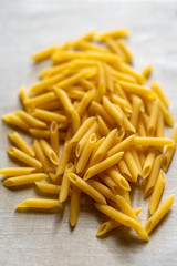 Uncooked Penne rigate pasta