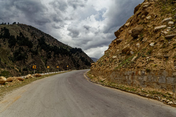 Road surrounded by rocky mountains