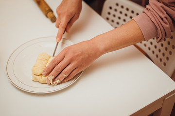 Cooking home. Сutting dough, mother and son baking together at home