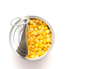 canned corn on a white background, open tin can, food preservation, space for text, close-up