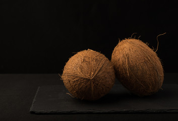 Coconut. Coconut isolated on black background. Full depth of field. Macro Photo food fruit coconut. Texture tropical fruit coconut nut. Image fruit coconuts.