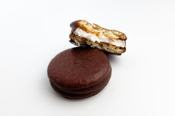 Chocolate coated pie on white background