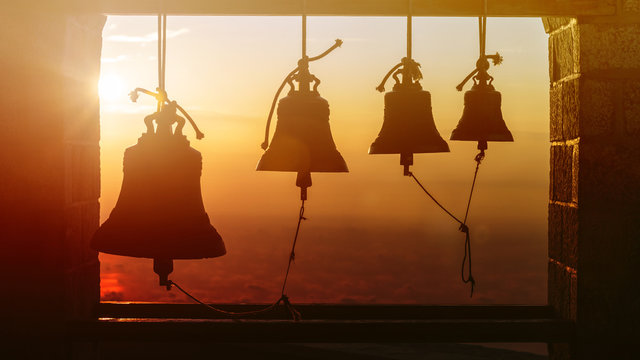 Bells at the Church on top of the Mount Athos in sinrise rays. Holy Mountain, Greece