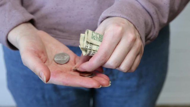 One dollar and petty cash only, empty pocket. No money. Economy crisis, poverty, unemployment concept. Consequences of coronavirus people isolation during quarantine. Inflation rates. Price growth.