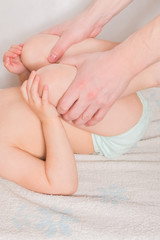 Obraz na płótnie Canvas doctor has a child on the massage table on the procedure