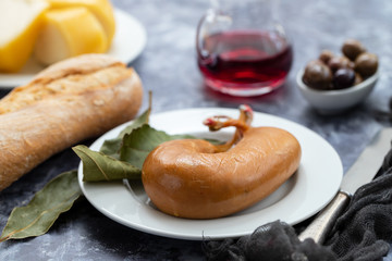 typical portuguese smoked sausage farinheira on white dish